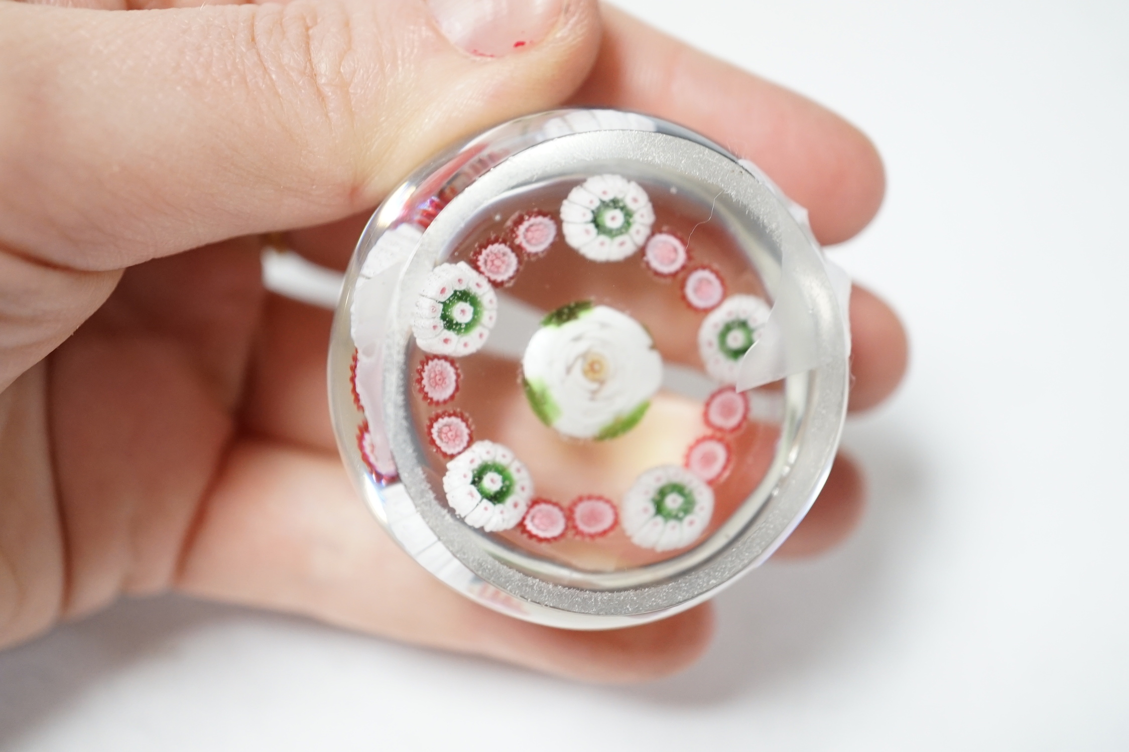 A Clichy green and white rose centred paperweight, 4cm in diameter